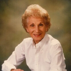 Helen Schley sits looking at the camera