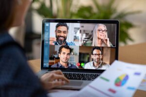 A computer screen showing four people on a virtual call.