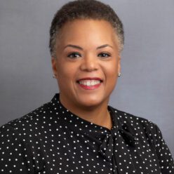 Smiling woman in dark shirt