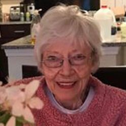 elderly woman with glasses and white hair