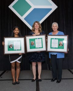 3 women holding Wertheimer award plaques