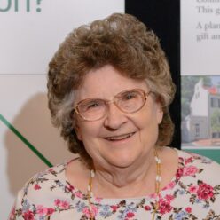 woman wearing glasses and floral shirt