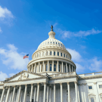 Capital Dome exterior image with an American flag waving in the wind