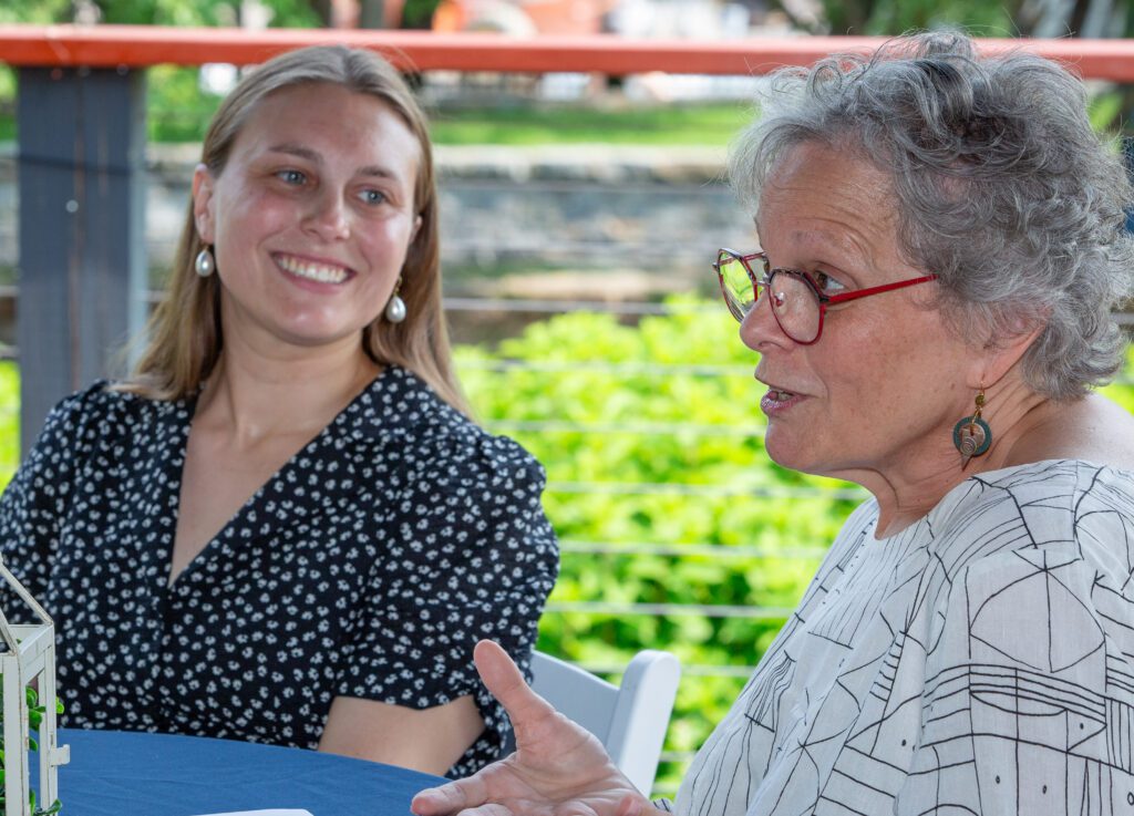 Jessie looks at Executive Director Niki Thrash