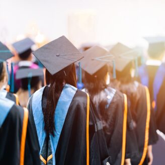 graduates stand in a line