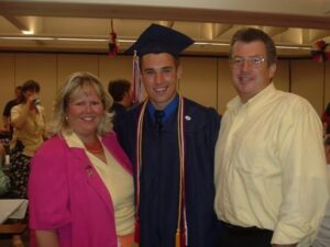 Charlton Kilgore standing with his family for graduation.