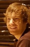Man smiling off to side of camera