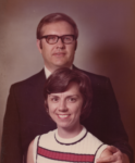 a man and a woman post smiling at the camera