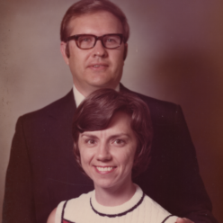 a man and a woman post smiling at the camera