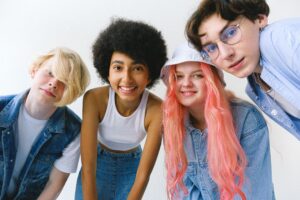 4 teens looking at the camera