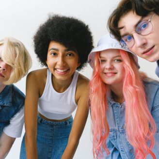 4 teens looking at the camera