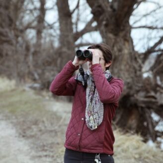 person with binoculars