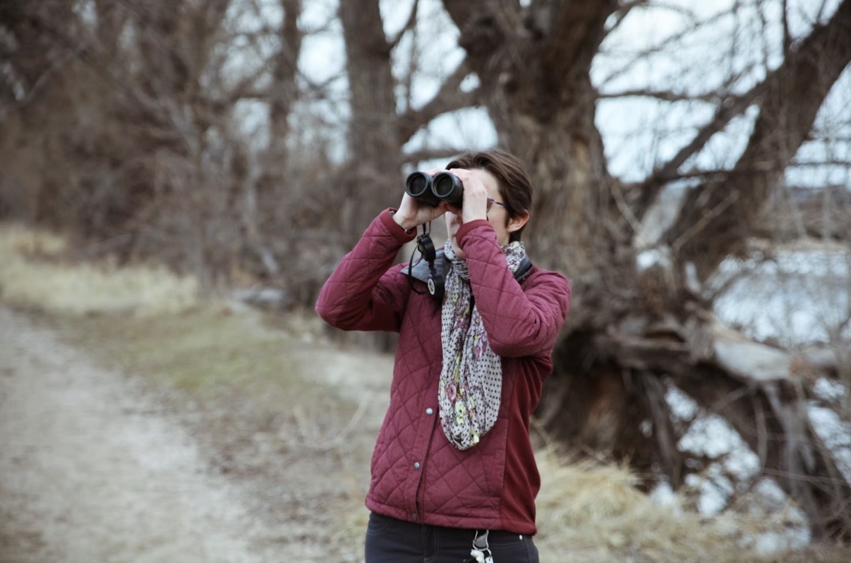 person with binoculars
